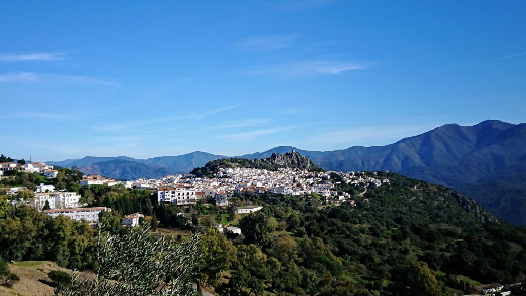 The white village of Gaucín on a hillside in the Serranía de Ronda, with mountains behind